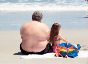 obesity men on the beach